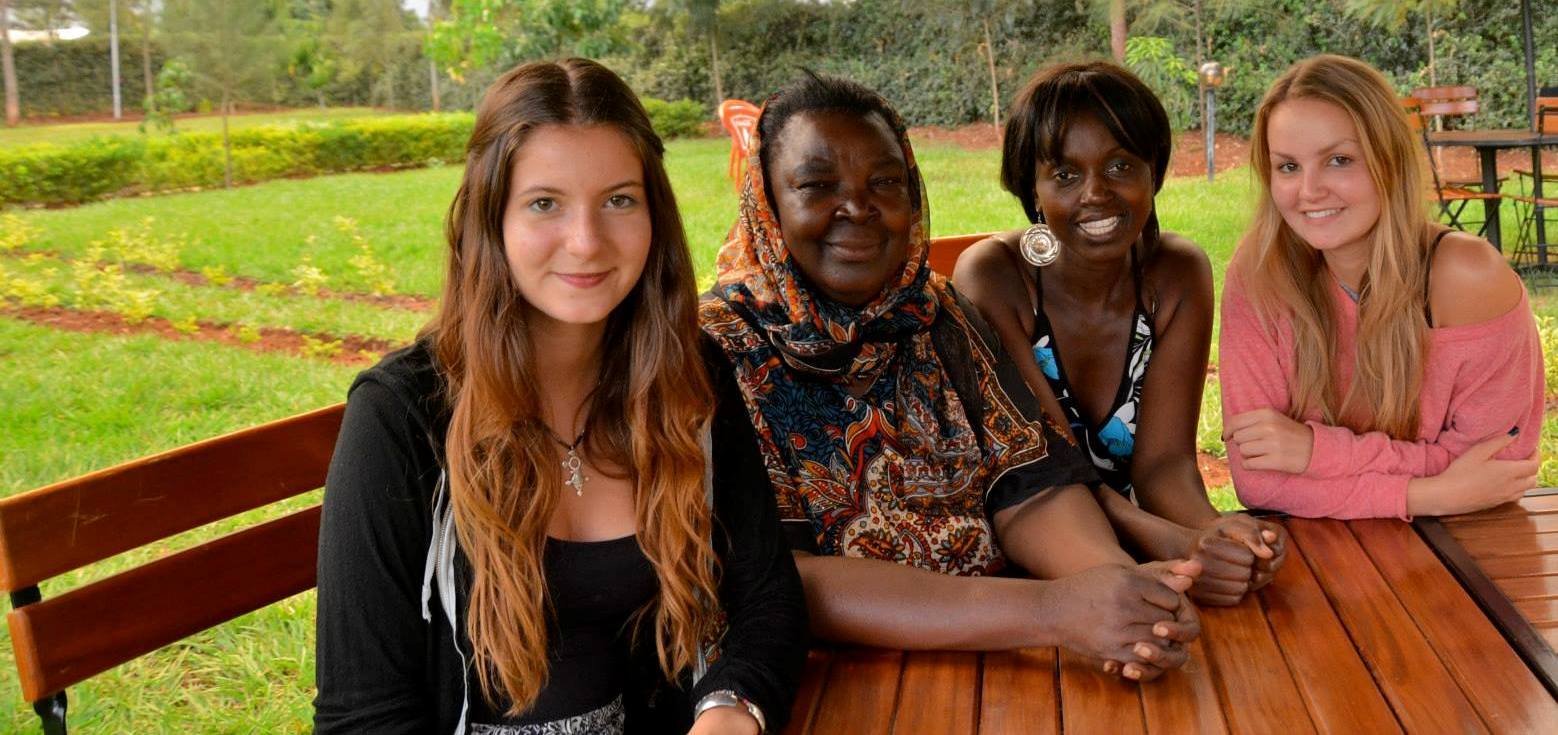 Beloved mother with three girls in a garden setting